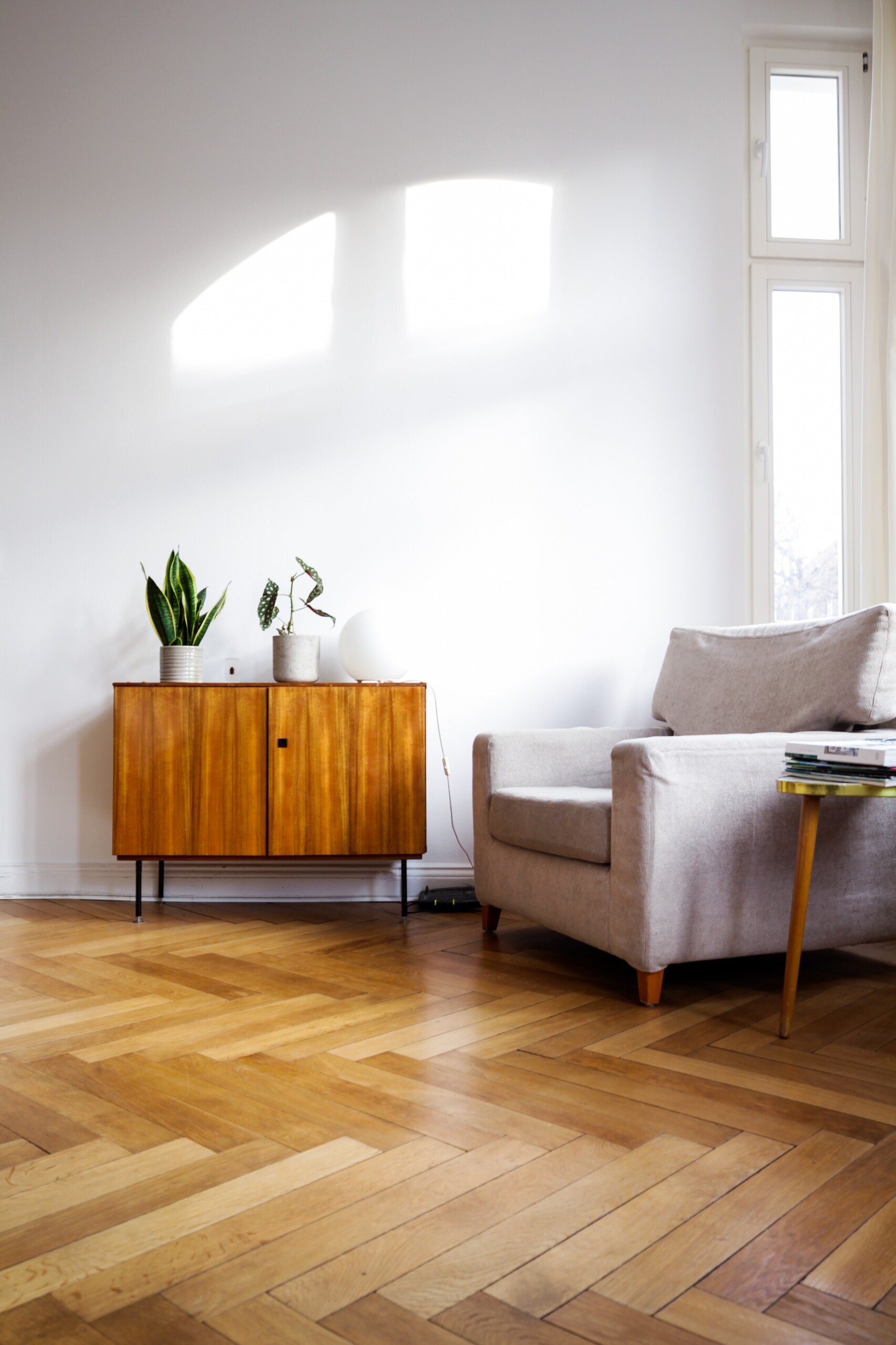 Brown wooden table beside gray couch